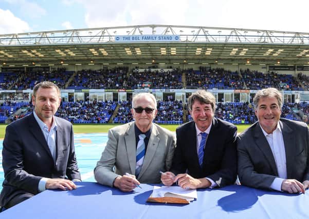 Peterborough United Co-owners Stewart Thompson, Darragh MacAnthony and Jason Neale along with Councillor John Holdich, leader of Peterborough City Council.
