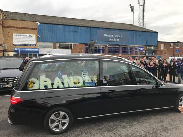 Fans burst into a round of applause and sang Tommy's name as the procession drove past the stadium