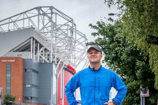 Nathan outside Old Trafford at the start of his epic challenge