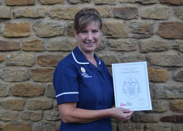 Wendy Osborne with her Queen's Nurse award