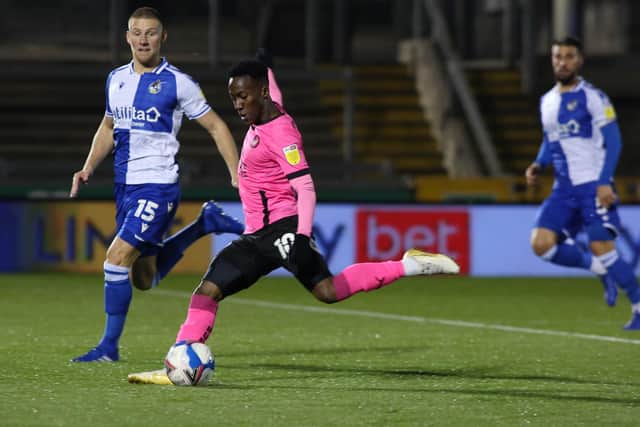 Siriki Dembele of Peterborough United shoots at goal past Alfie Kilgour of Bristol Rovers. Photo: Joe Dent/theposh.com.