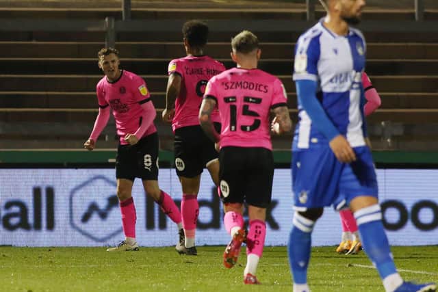 Jack Taylor of Peterborough United (left) celebrates scoring the opening goal of the game  at Bristol Rovers. Photo: Joe Dent/theposh.com.