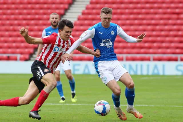 Jack Taylor (right) in action for Posh.