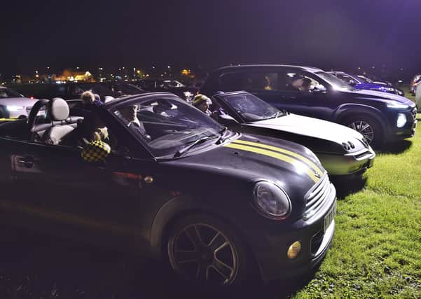 Cars line-up at a drive-in event at the Showground this month