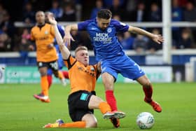 Barnet's Harry Taylor tackles Gwion Edwards of Posh in a 2017 match. Photo: Joe Dent/theposh.com.
