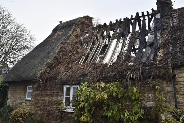The remains of the fire damaged thatched roof in Castor