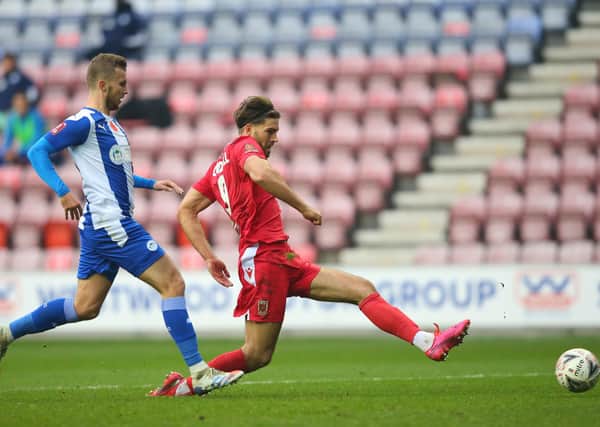 Harry Cardwell of Chorley scores his side's second goal during the FA Cup first round match at Wigan. (Photo by Alex Livesey/Getty Images).