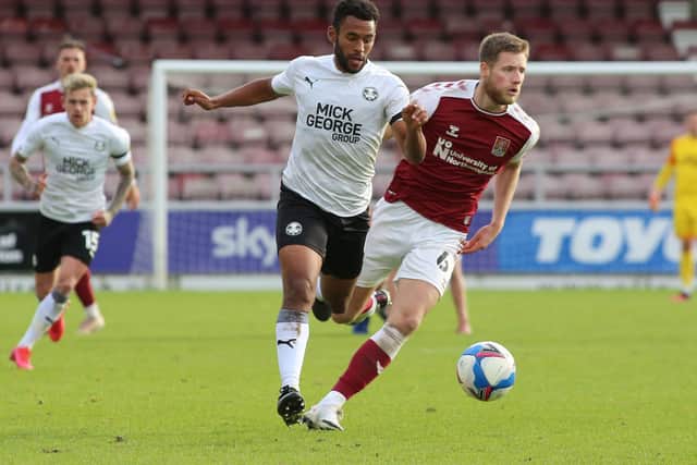 Nathan Thompson (left) in action for Posh.
