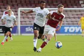 Nathan Thompson (left) in action for Posh.
