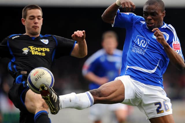 Gaby Zakuani (blue) in action early in his Posh career.