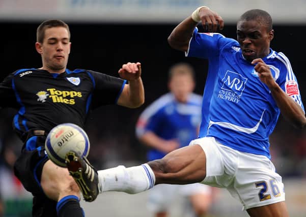 Gaby Zakuani (blue) in action early in his Posh career.