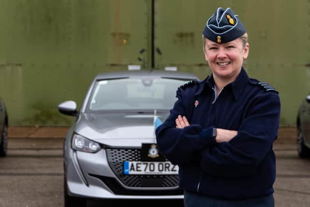 Group Captain Jo Lincoln with the new electric vehicles