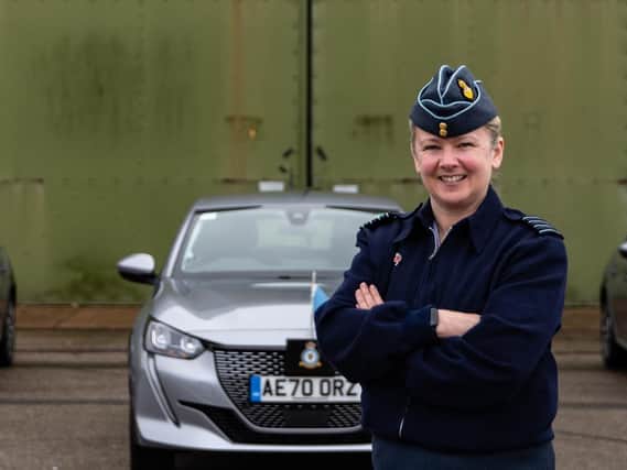 Group Captain Jo Lincoln with the new electric vehicles