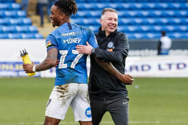 Posh boss Darren Ferguson with Ivan Toney.