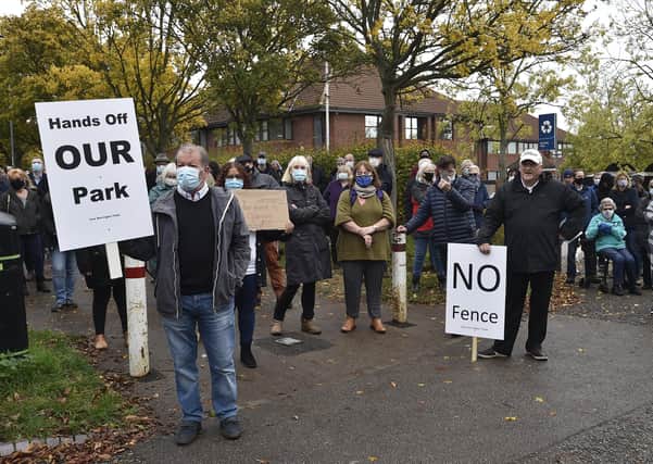 Werrington residents protest against a fence being erected around the playing fields behind Ken Stimpson School  in October.