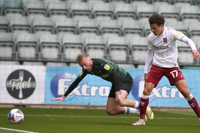 Former Posh player George Cooper (left) now plays for Plymouth. Photo: Pete Norton Getty Images