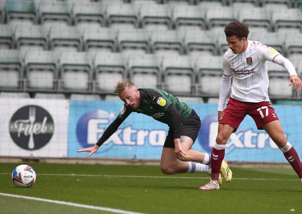 Former Posh player George Cooper (left) now plays for Plymouth. Photo: Pete Norton Getty Images