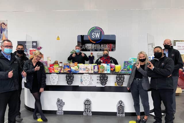 Some of the staff with the donations