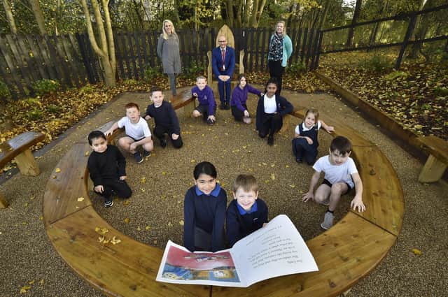 Orton Wistow primary school headteacher Simon Eardley with Sophie Chambers, chair of the Friends group and English lead teacher Rachel Tansley and pupils at their outdoor reading area. EMN-201011-112935009