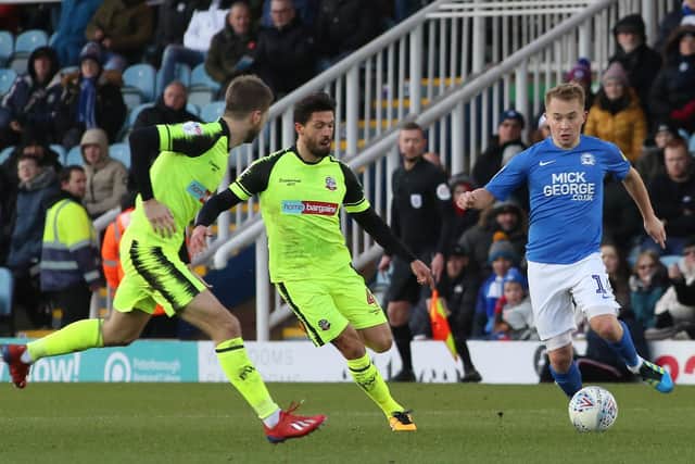 Luke Murphy (centre) playing for Bolton against Posh.