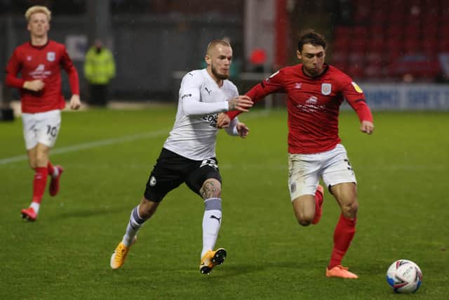 Joe Ward of Peterborough United in action with Crewe goalscorer Harry Pickering. Photo: Joe Dent/theposh.com.