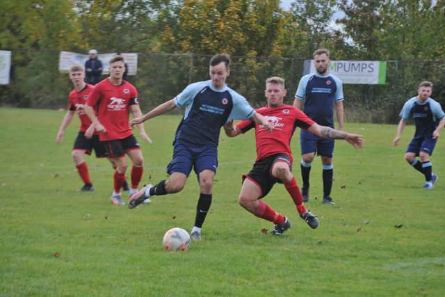 Action from the recent game between Stilton United (red) and Netherton United. Photo: David Lowndes.