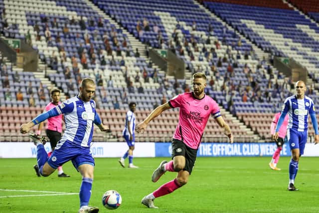 Mark Beevers (right) in action for Posh at Wigan.