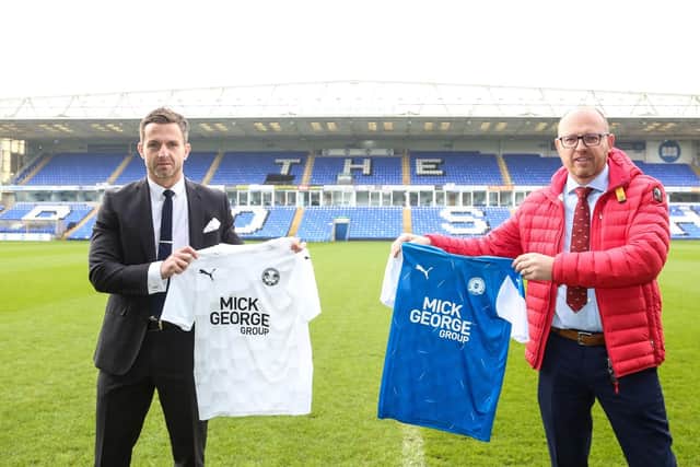 Alex Harris of Posh (left) and Neil Johnson of Mick George Ltd.