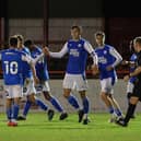 Charlie O'Connell (centre) takes the plaudits from his teammates after scoring for Posh Youths at Altrincham. Photo: Joe Dent/theposh.com.