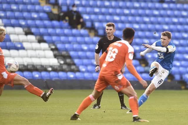 Posh midfielder Jack Taylor lets fly at the Blackpool goal. Photo: David Lowndes.