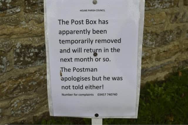 A note has been placed where the stolen postbox stood