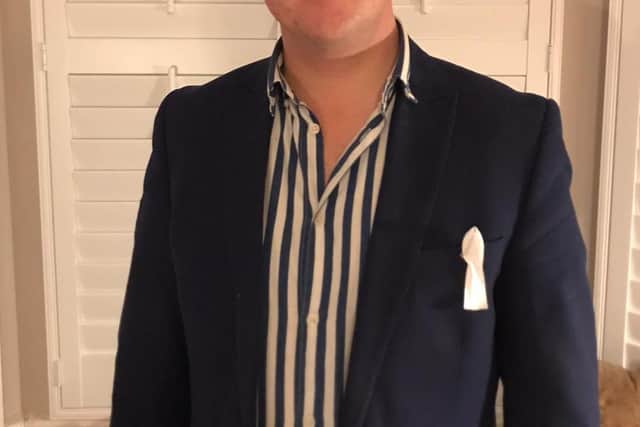 MP for Peterborough Paul Bristow wearing a White Ribbon ribbon