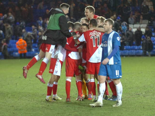 Compare the joy of the Kidderminster players with the despair of Posh skipper Grant McCann after an FA Cup shock in 2014.