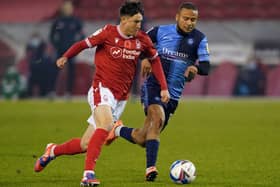 Joe Lolley (red) in action against Nottingham Forest. Photo: Zac Goodwin PA wire.