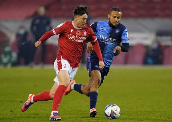 Joe Lolley (red) in action against Nottingham Forest. Photo: Zac Goodwin PA wire.