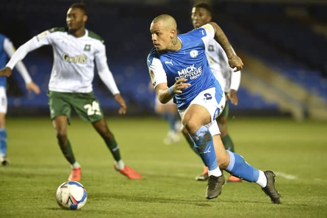 Jonson Clarke-Harris is about to shoot and score for Posh against Plymouth. Photo: David Lowndes.