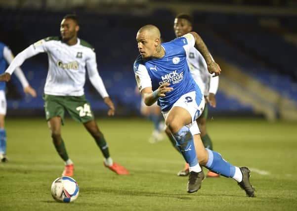 Jonson Clarke-Harris is about to shoot and score for Posh against Plymouth. Photo: David Lowndes.