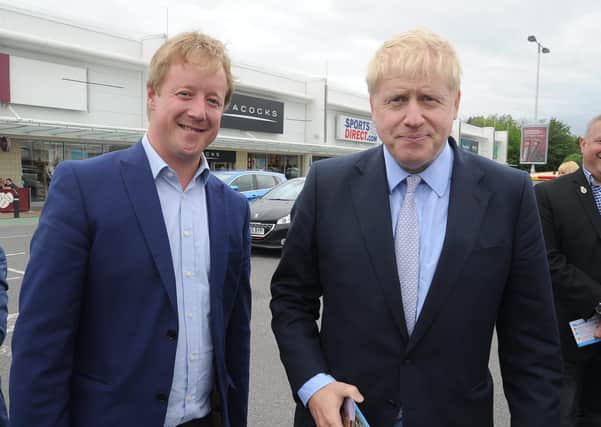 Peterborough MP Paul Bristow with Prime Minister Boris Johnson during a walkabout in Peterborough. EMN-190531-152748009