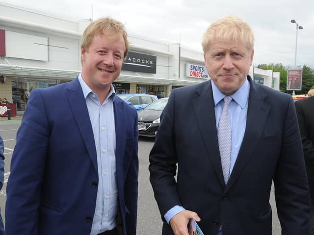 Peterborough MP Paul Bristow with Prime Minister Boris Johnson during a walkabout in Peterborough. EMN-190531-152748009