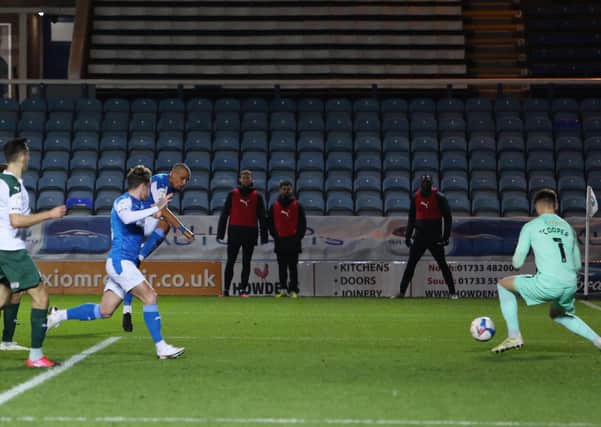 Jonson Clarke-Harris of Peterborough United scores the only goal of the game against Plymouth. Photo: Joe Dent/theposh.com.