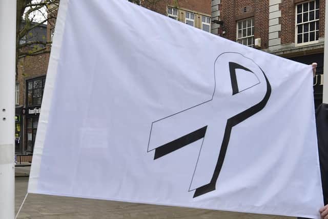 A White Ribbon flag was raised at the Town Hall at the start of a domestic abuse campaign this week.