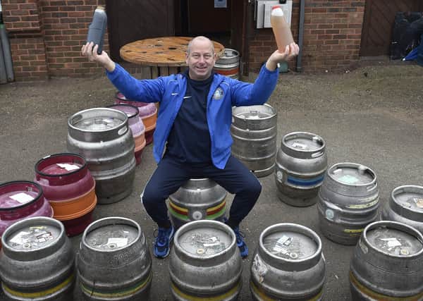 Andy Simmonds , owner, at The Ploughman pub, Werrington selling takeaway beer. EMN-200525-085728009