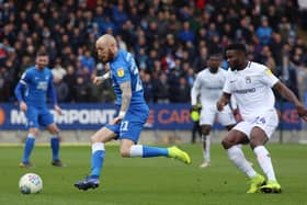 Marcus Maddison of Posh in action with Bright Enobakhare (right) of Coventry City in 2019. Photo: Joe Dent/theposh.com.