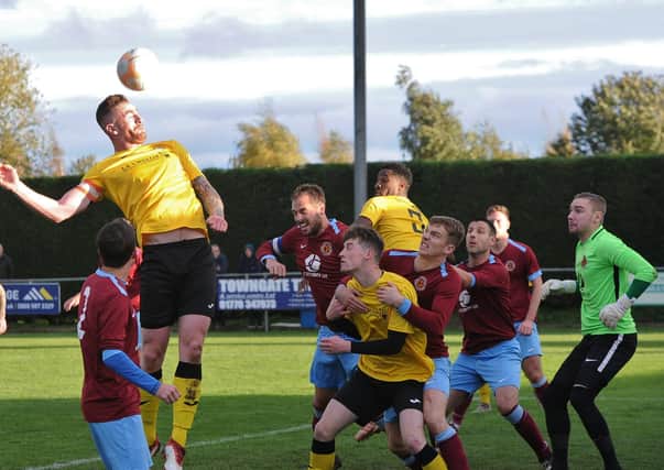 Deeping Rangers (claret) in FA Vase action two seasons ago.
