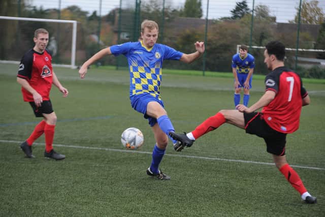 Action from the recent game between Netherton United (red) and Peterborough North End Sports.