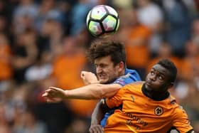 Leicester City's Harry Maguire (left) battles for the ball with Wolverhampton Wanderers' Bright Enobakhare. Photo: Martin Ricketts PA wire.