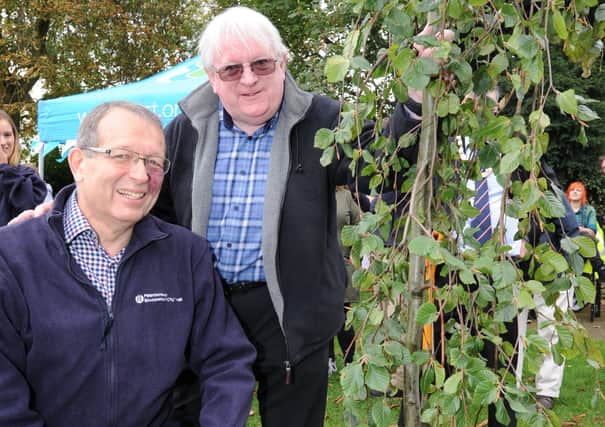 Planting of the 100,000th tree in the Forest for Peterborough three years ago at Central Park Steve Magenis, chairman of PECT with  Iain Crighton who planted the first trees at Thorpe Meadows EMN-170710-200619009