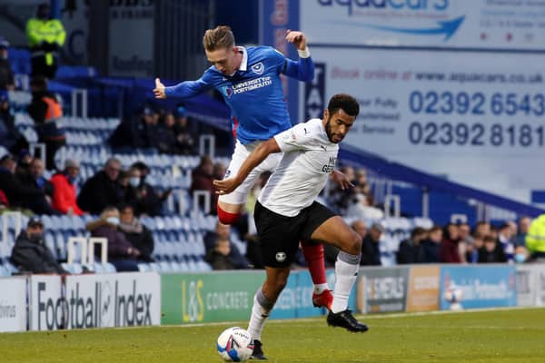 Nathan Thompson of Peterborough United in action with Ronan Curtis of Portsmouth.  Photo: Joe Dent/theposh.com.