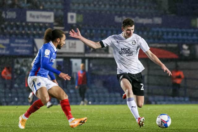 Posh midfielder Ethan Hamilton in action with Marcus Harness of Portsmouth. Photo: Joe Dent/theposh.com.