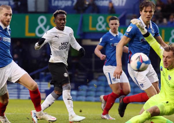 Siriki Dembele of Peterborough United has an effort at goal against Portsmouth. Photo: Joe Dent/theposh.com.